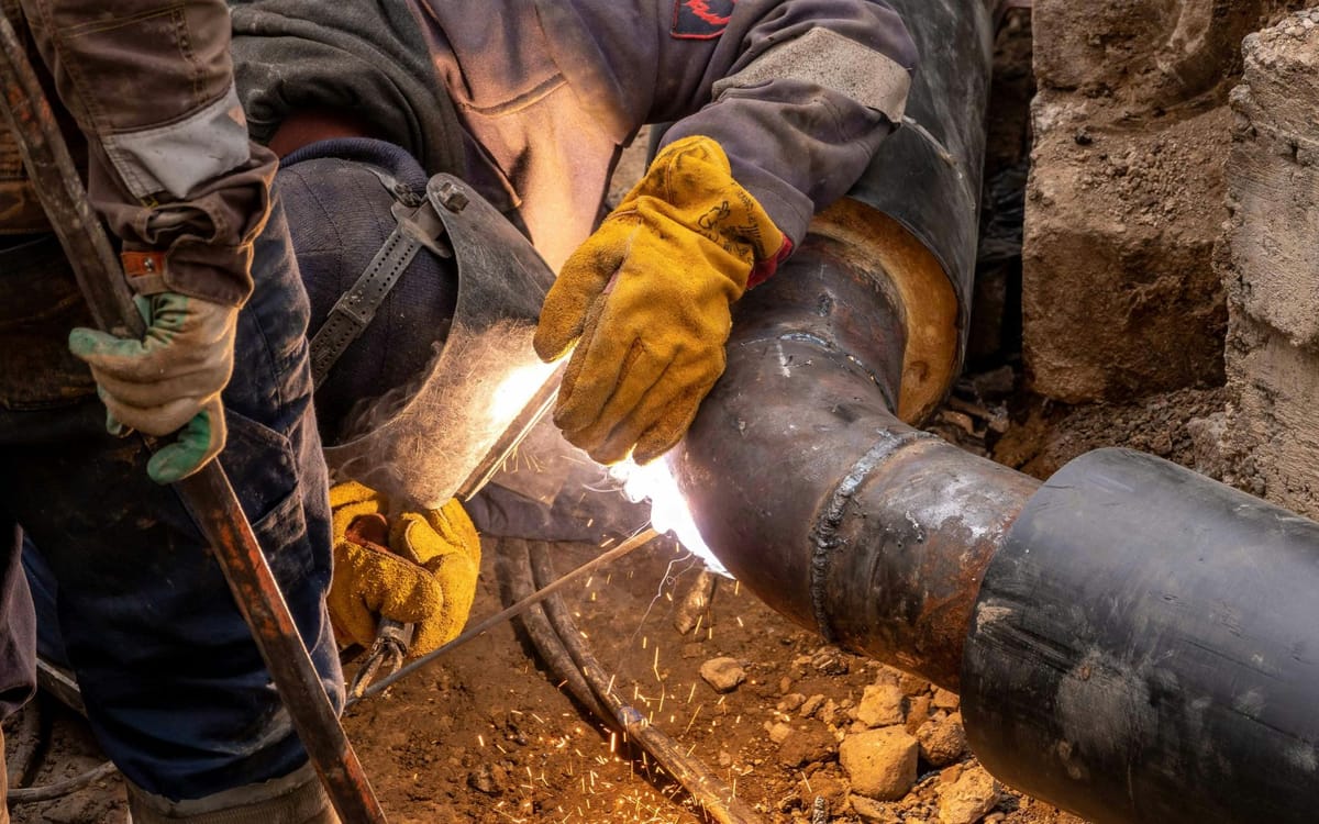 Sewer drain line repair in an excavated trench