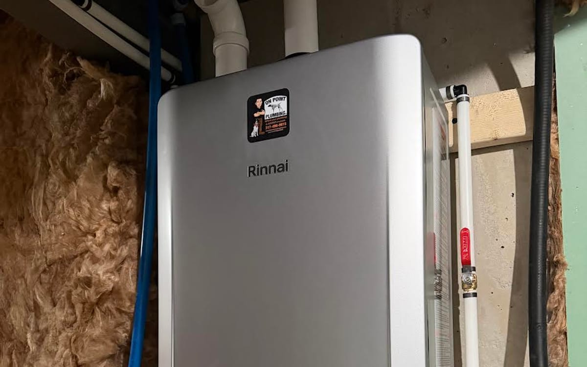 Rinnai tankless water heater installed by On Point Plumbing reading 130 degrees