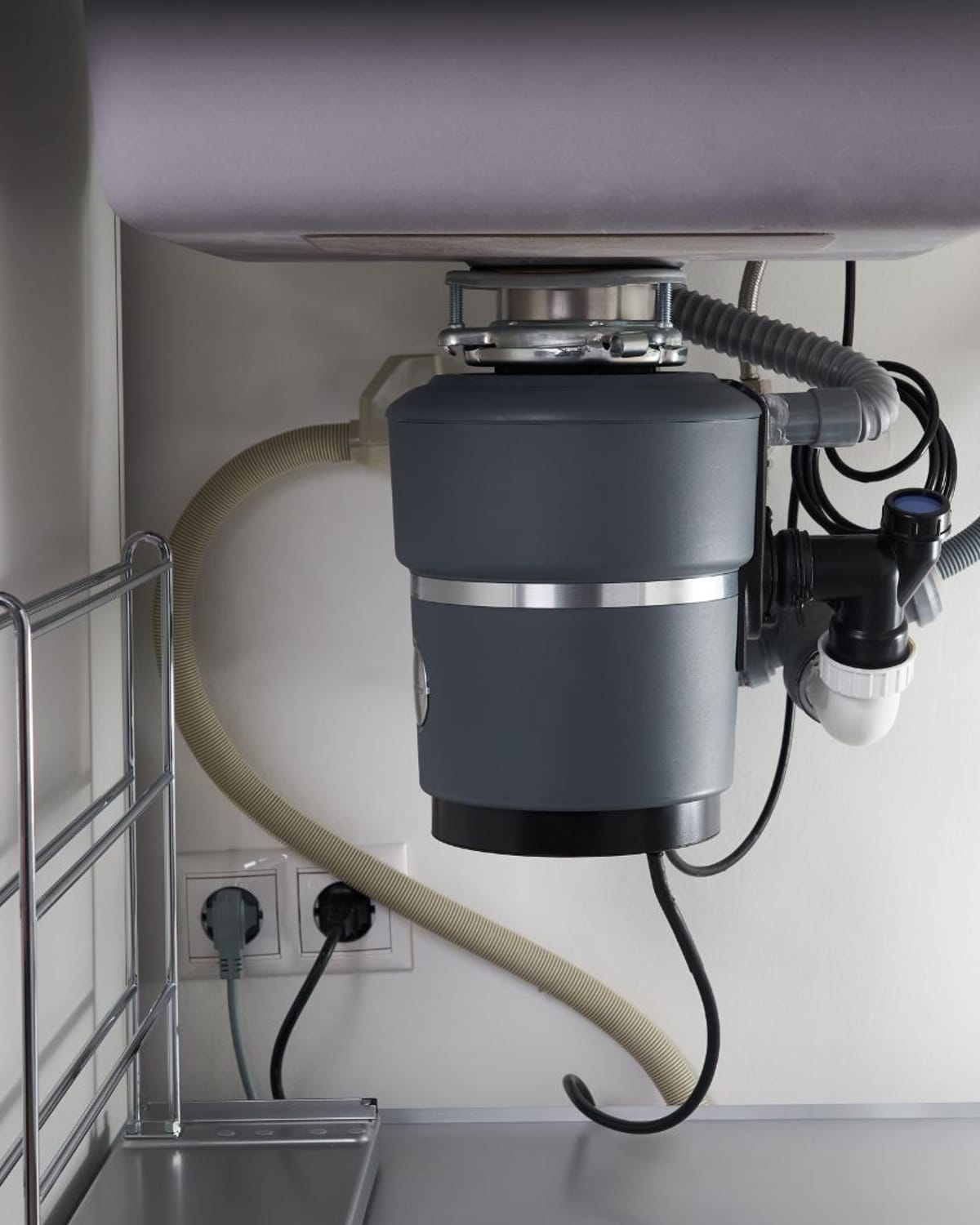 Disposal and drain connections finished under a Plainfield sink