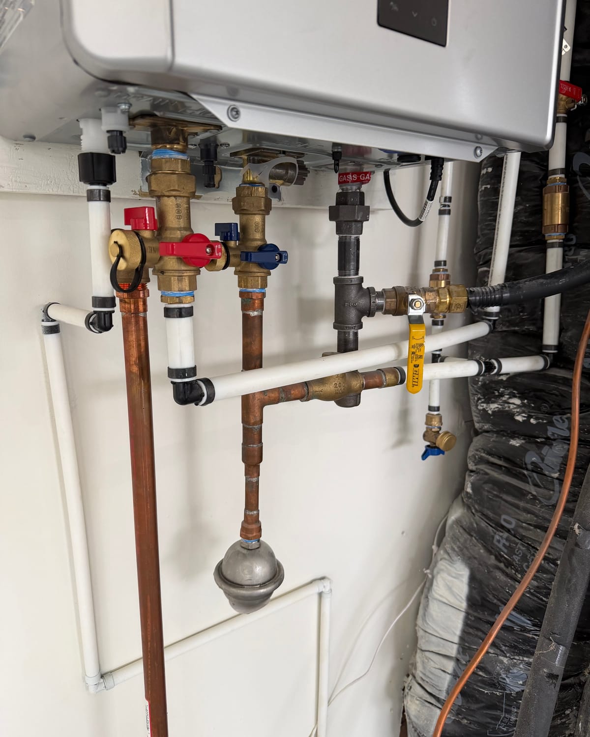 Isolation valves and gas connections serviced on a Greenwood water heater