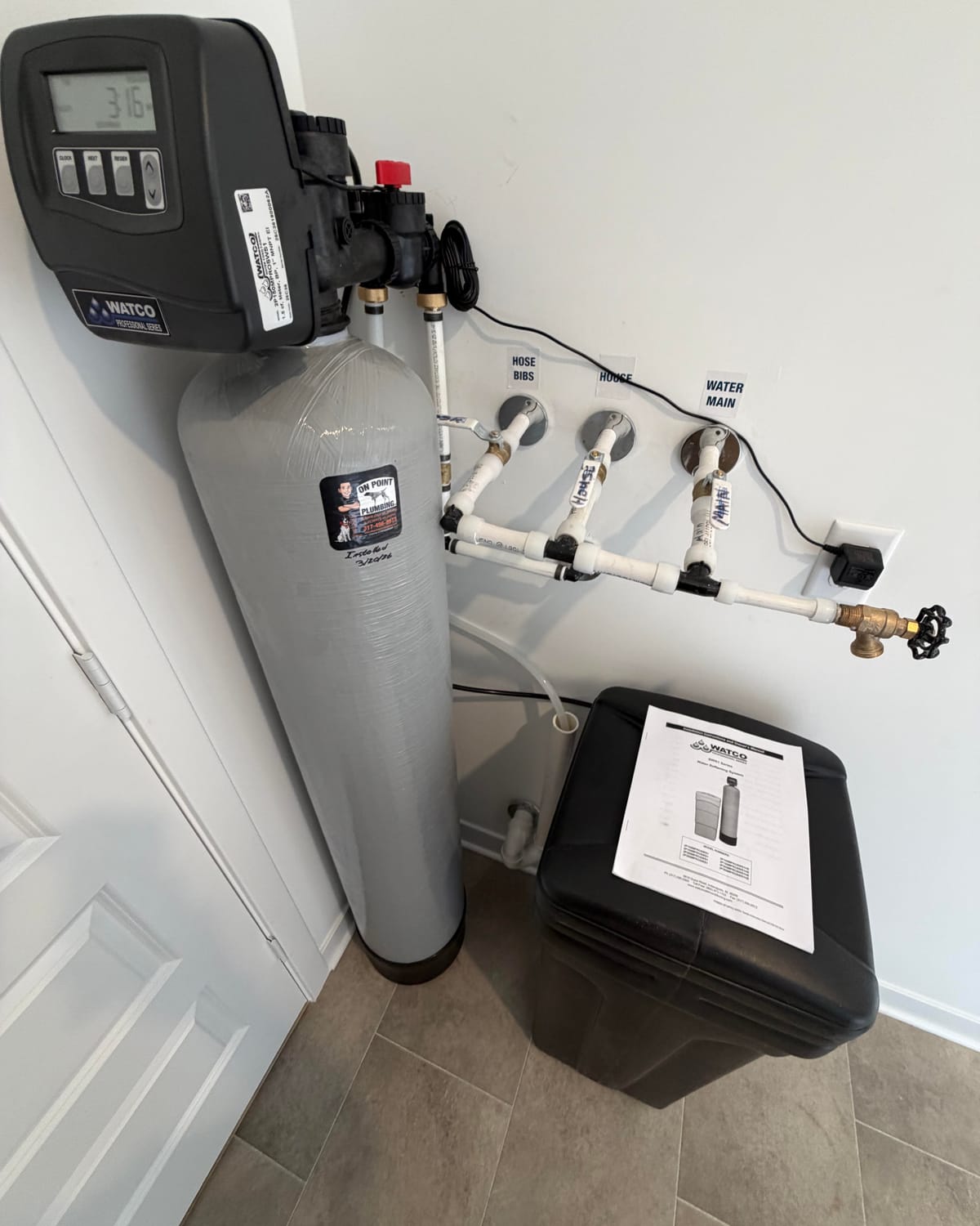 WATCO water softener installed by On Point Plumbing with labeled shut-off valves