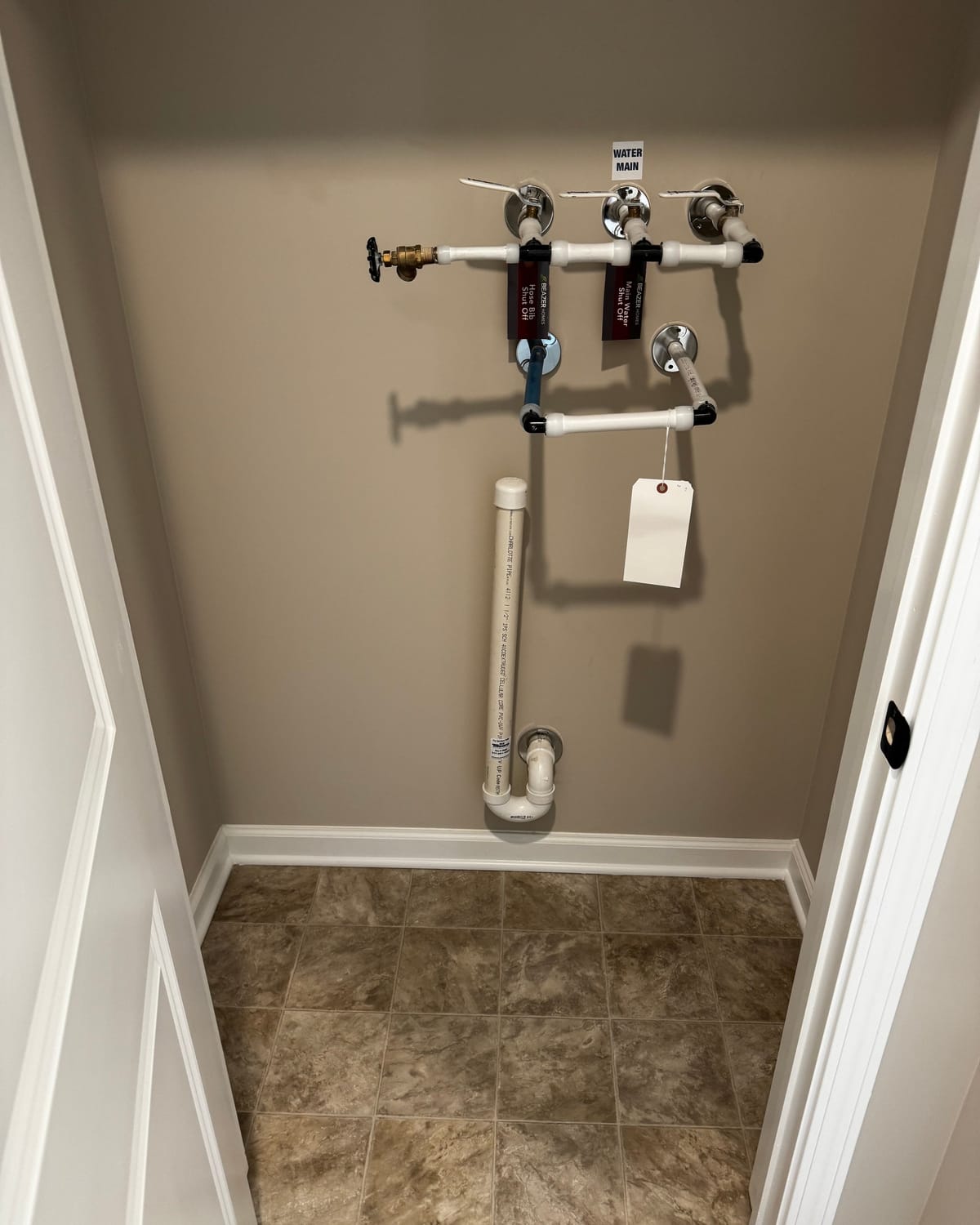 Labeled shut-off valves installed during a leak repair