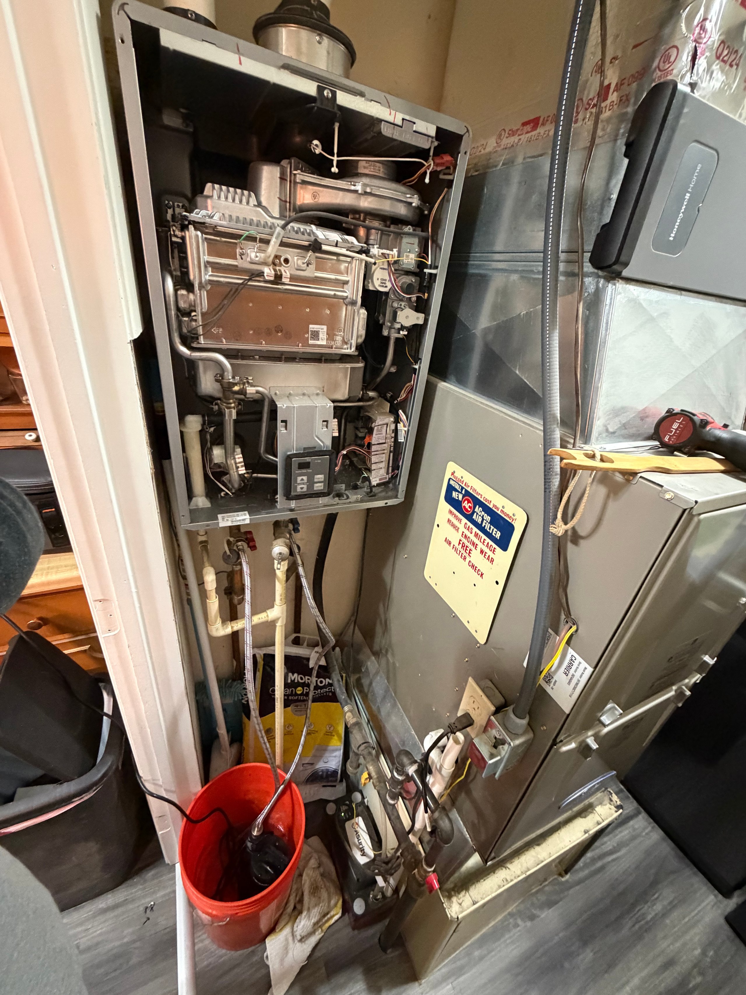 Exposed plumbing system with water heater and complex mechanical components